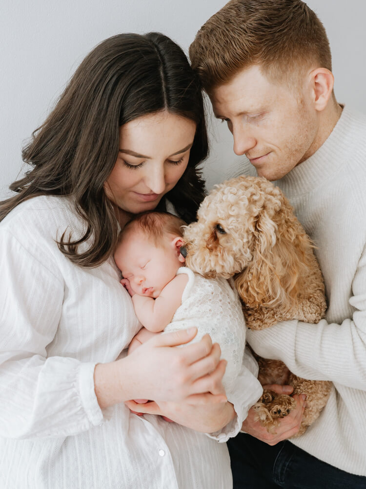 newborn family portrait with pet - photographed by Natasha Cranley