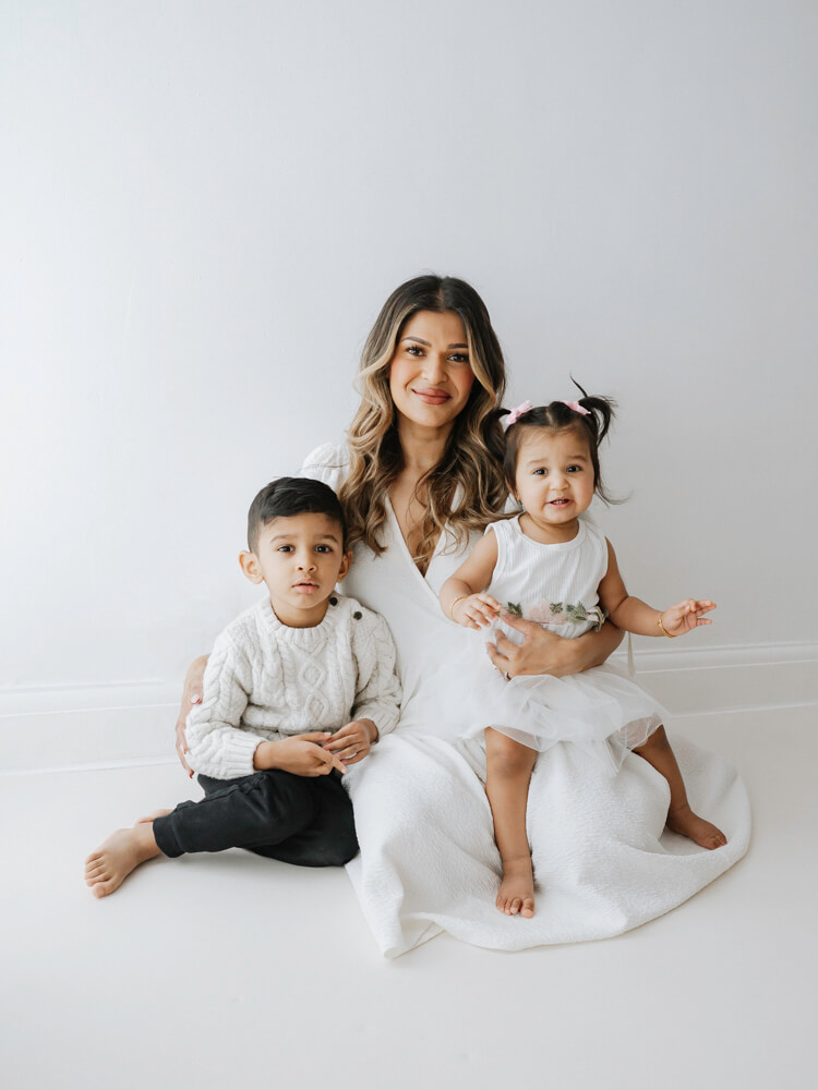 Mum holding young children -photographed by Natasha Cranley